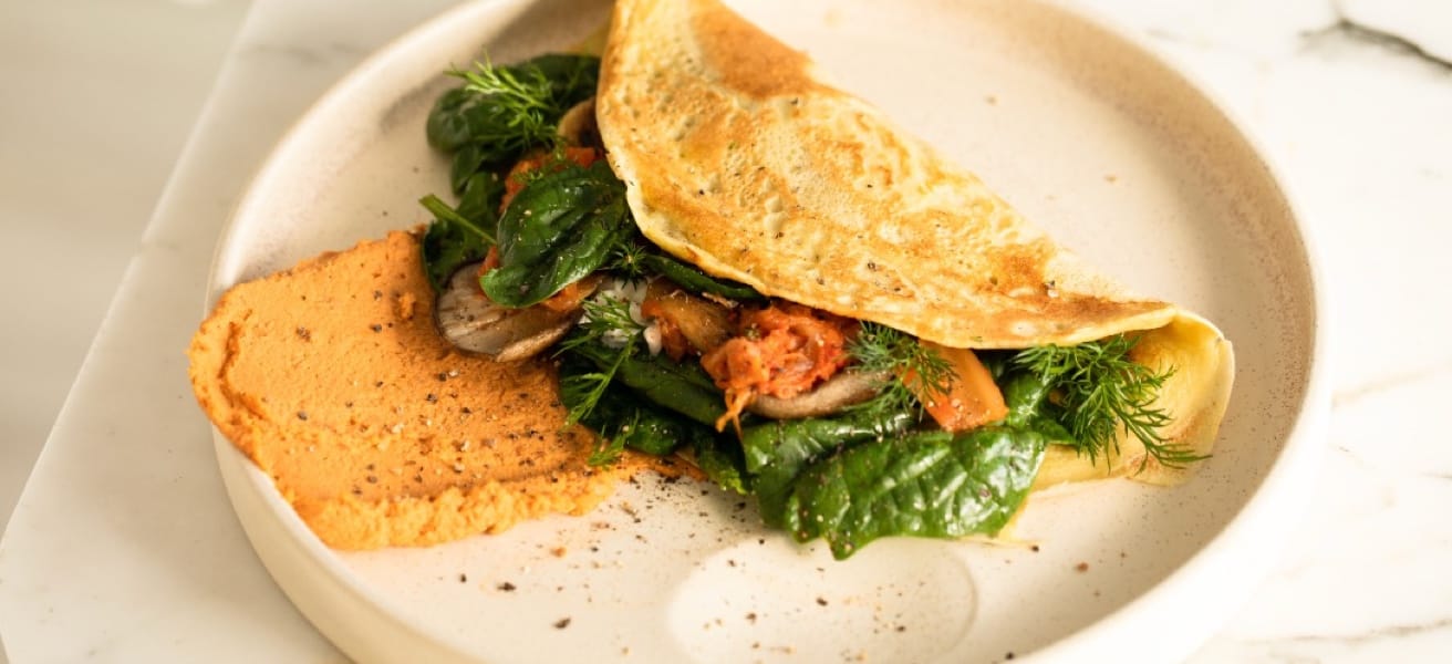 An easy and quick dish, perfect for any meal. This classic omelette combines beaten eggs cooked to perfection, optionally filled with your choice of cheese, vegetables, or meats